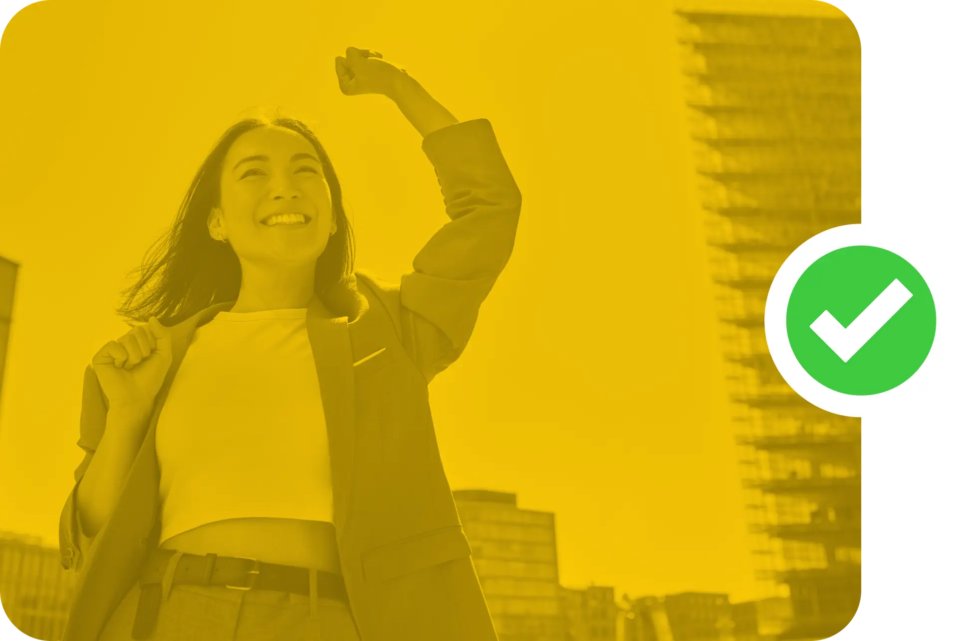 Image of a smiling professional woman, with her left arm raised in triump.