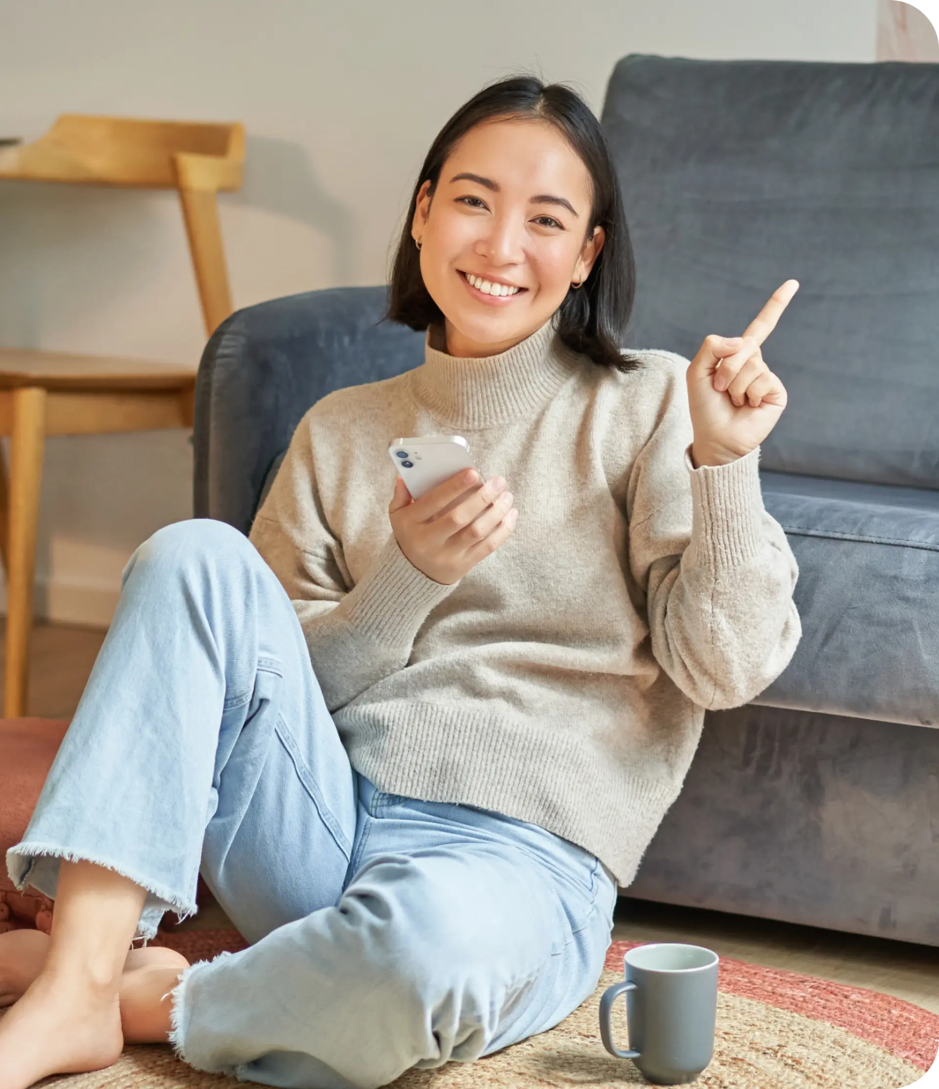 Woman sitting with a phone